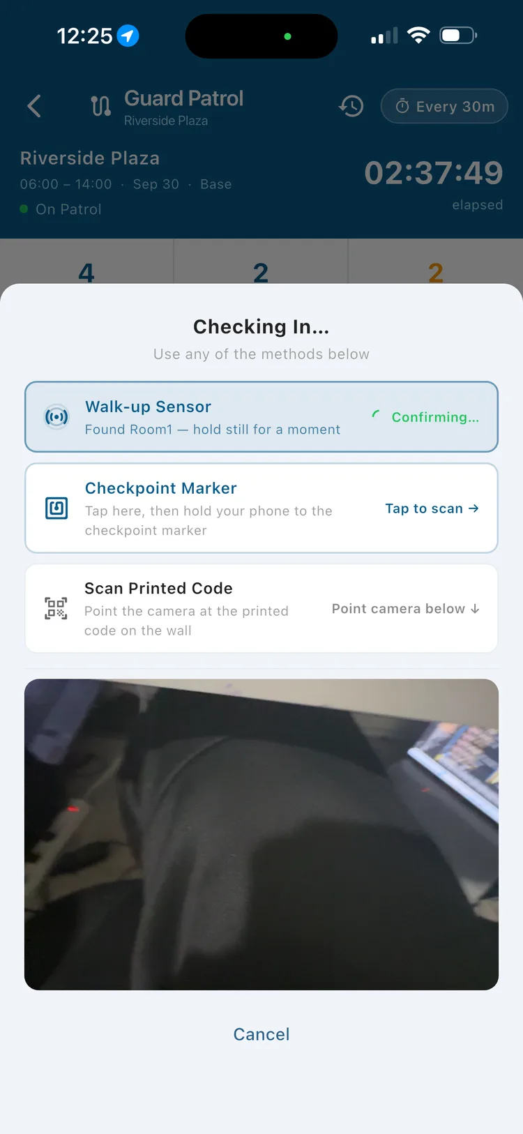 Secureburg check-in screen automatically detecting a nearby Walk-up Sensor beacon and confirming Room 1 while holding the phone still